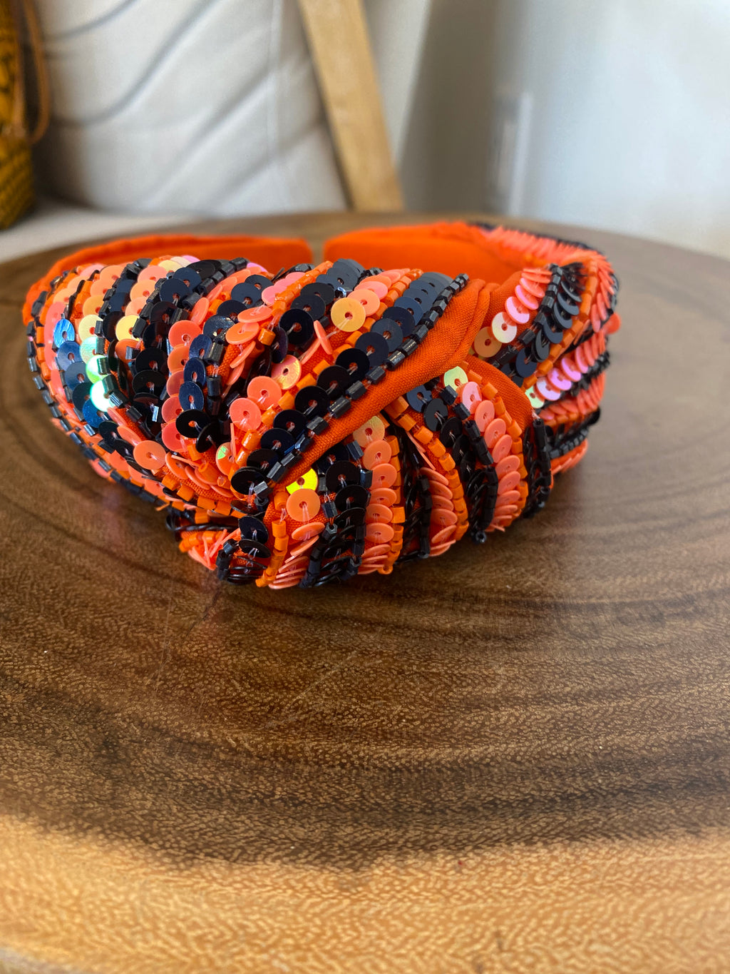 Orange and navy blue knotted sequin